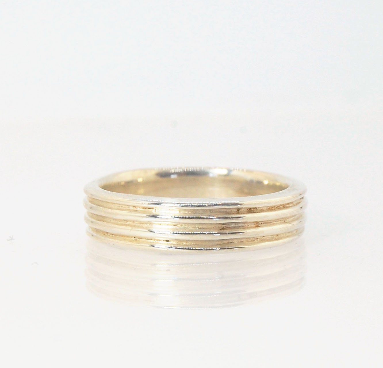 4 Rim Heavy Band 6mm wide - in Gold or Silver This is a heavy band cast from a wax carving turned on a lathe. These are so much fun to make! I have several different variations of this design.6mm wide and 2 mm thickThis ring is pictured in sterling silver