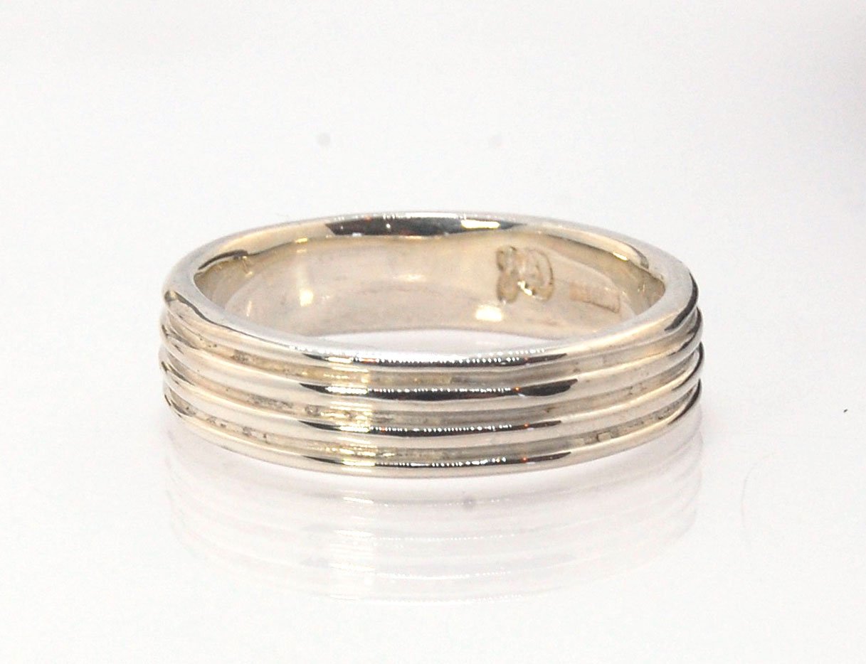 4 Rim Heavy Band 6mm wide - in Gold or Silver This is a heavy band cast from a wax carving turned on a lathe. These are so much fun to make! I have several different variations of this design.6mm wide and 2 mm thickThis ring is pictured in sterling silver