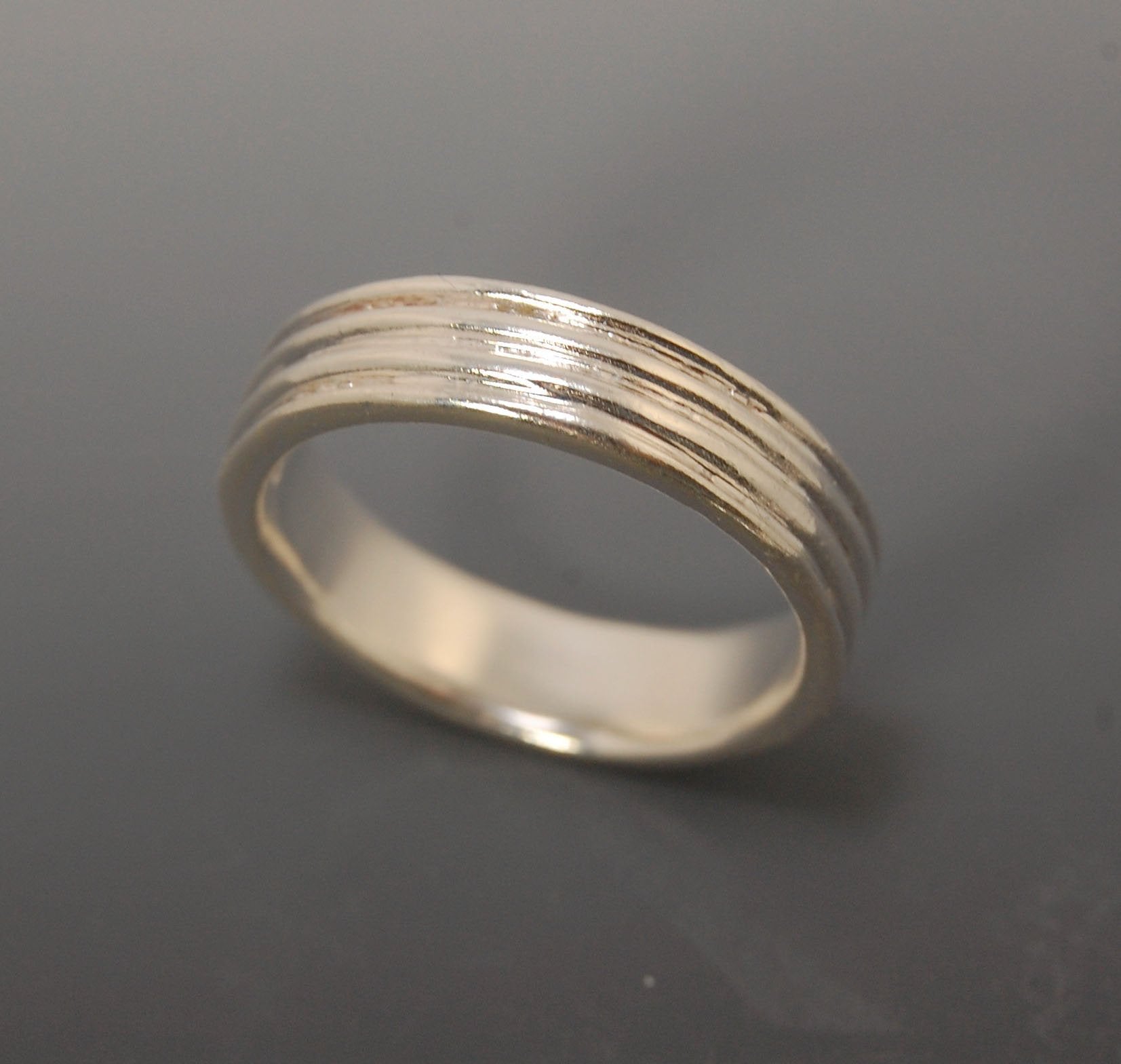 4 Rim Heavy Band 6mm wide - in Gold or Silver This is a heavy band cast from a wax carving turned on a lathe. These are so much fun to make! I have several different variations of this design.6mm wide and 2 mm thickThis ring is pictured in sterling silver