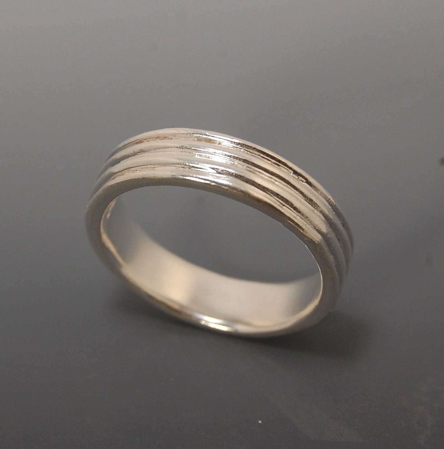 4 Rim Heavy Band 6mm wide - in Gold or Silver This is a heavy band cast from a wax carving turned on a lathe. These are so much fun to make! I have several different variations of this design.6mm wide and 2 mm thickThis ring is pictured in sterling silver