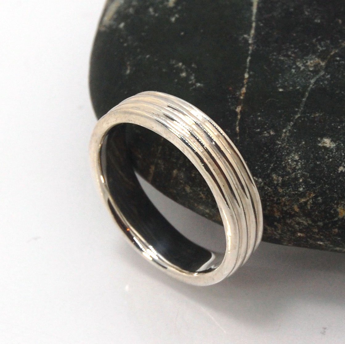 4 Rim Heavy Band 6mm wide - in Gold or Silver This is a heavy band cast from a wax carving turned on a lathe. These are so much fun to make! I have several different variations of this design.6mm wide and 2 mm thickThis ring is pictured in sterling silver