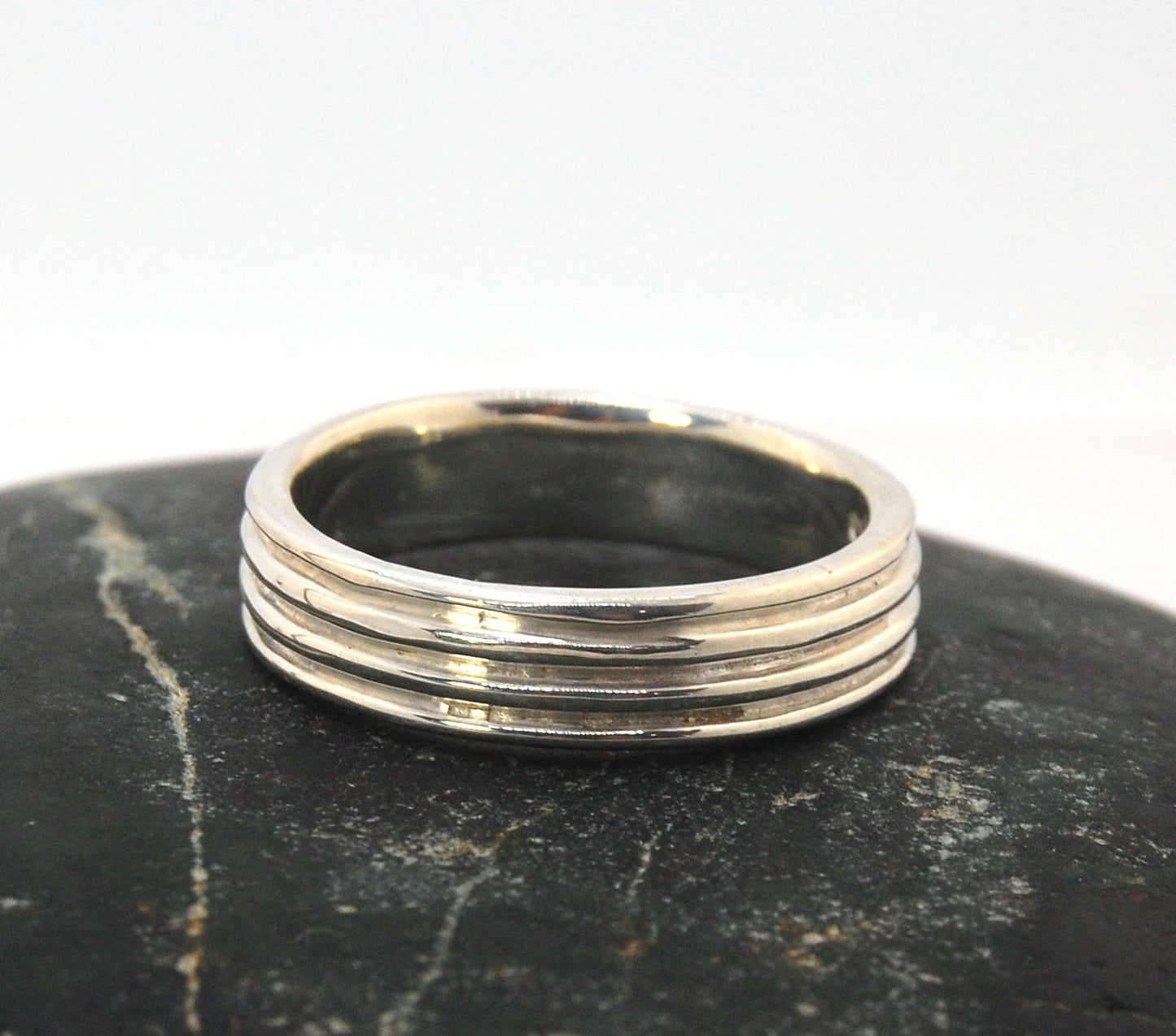 4 Rim Heavy Band 6mm wide - in Gold or Silver This is a heavy band cast from a wax carving turned on a lathe. These are so much fun to make! I have several different variations of this design.6mm wide and 2 mm thickThis ring is pictured in sterling silver