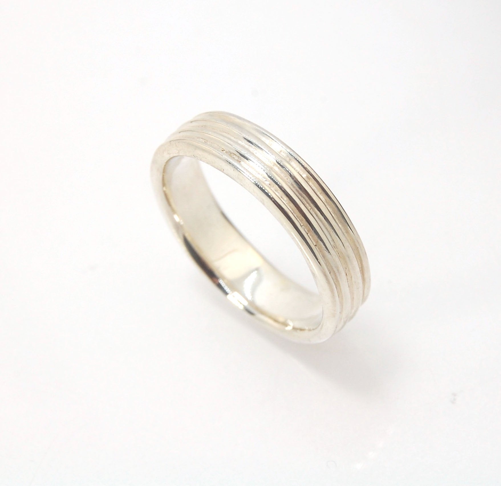 4 Rim Heavy Band 6mm wide - in Gold or Silver This is a heavy band cast from a wax carving turned on a lathe. These are so much fun to make! I have several different variations of this design.6mm wide and 2 mm thickThis ring is pictured in sterling silver