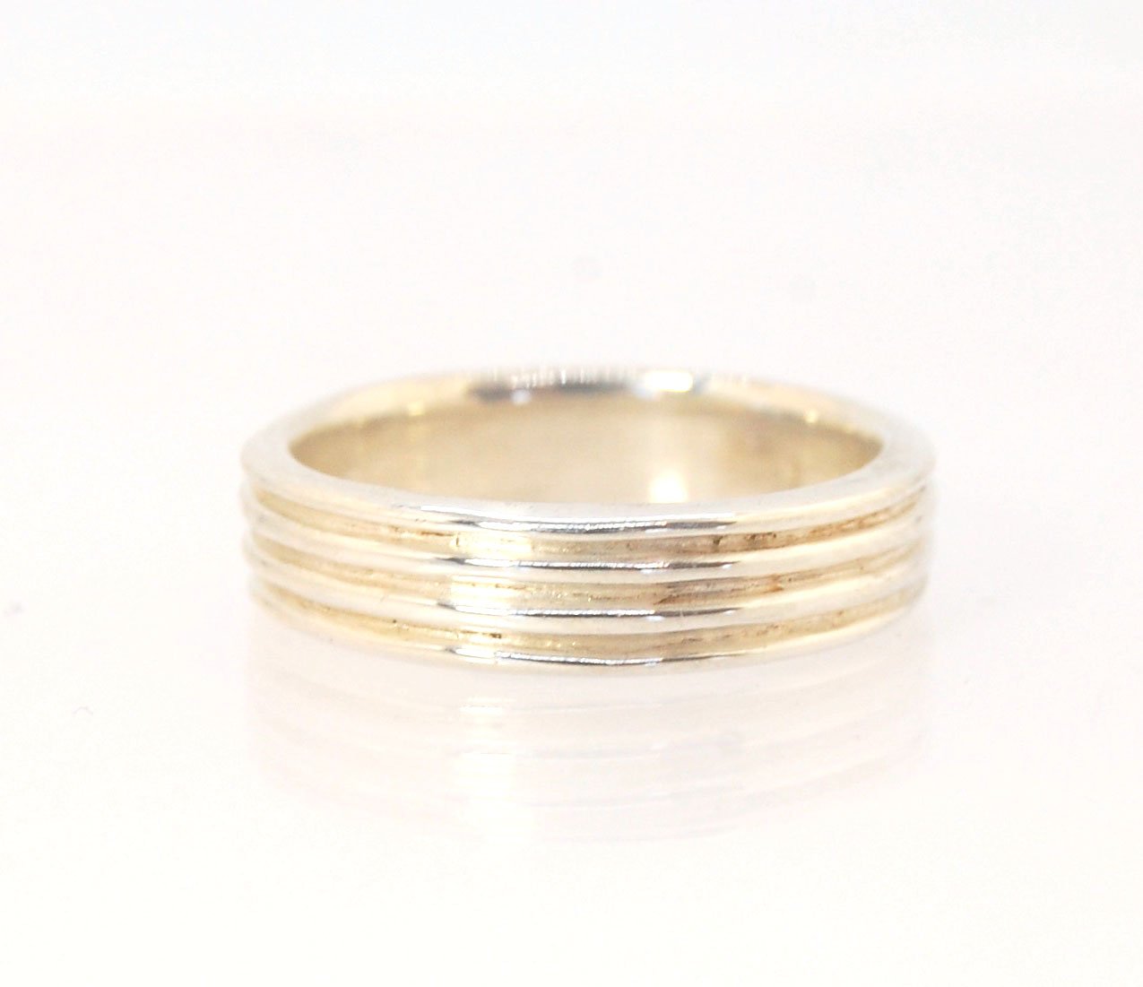 4 Rim Heavy Band 6mm wide - in Gold or Silver This is a heavy band cast from a wax carving turned on a lathe. These are so much fun to make! I have several different variations of this design.6mm wide and 2 mm thickThis ring is pictured in sterling silver