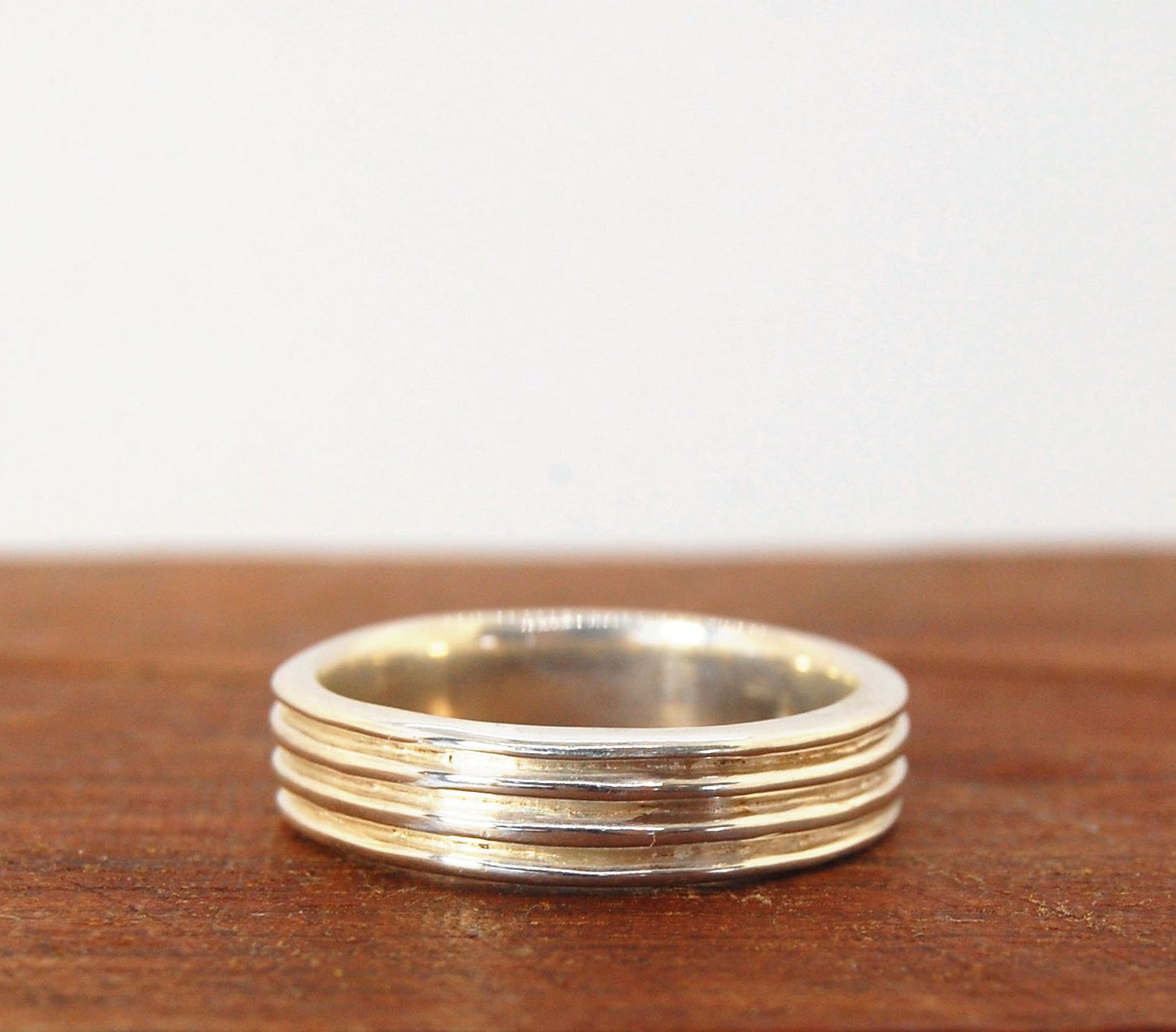 4 Rim Heavy Band 6mm wide - in Gold or Silver This is a heavy band cast from a wax carving turned on a lathe. These are so much fun to make! I have several different variations of this design.6mm wide and 2 mm thickThis ring is pictured in sterling silver