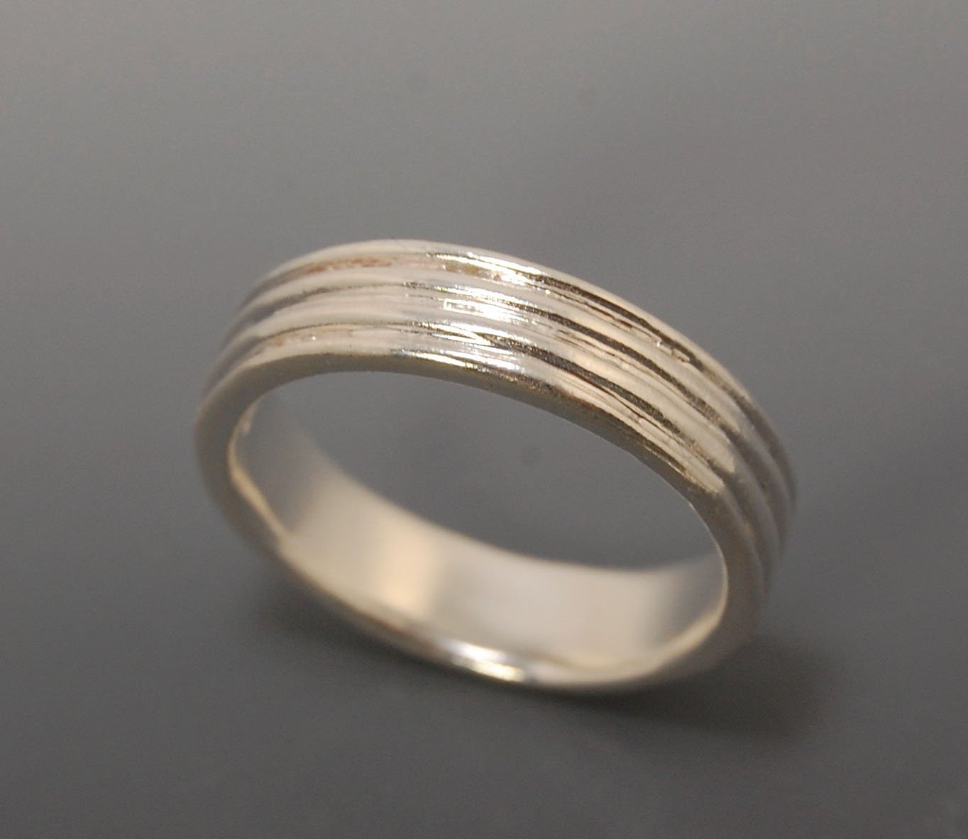 4 Rim Heavy Band 6mm wide - in Gold or Silver This is a heavy band cast from a wax carving turned on a lathe. These are so much fun to make! I have several different variations of this design.6mm wide and 2 mm thickThis ring is pictured in sterling silver