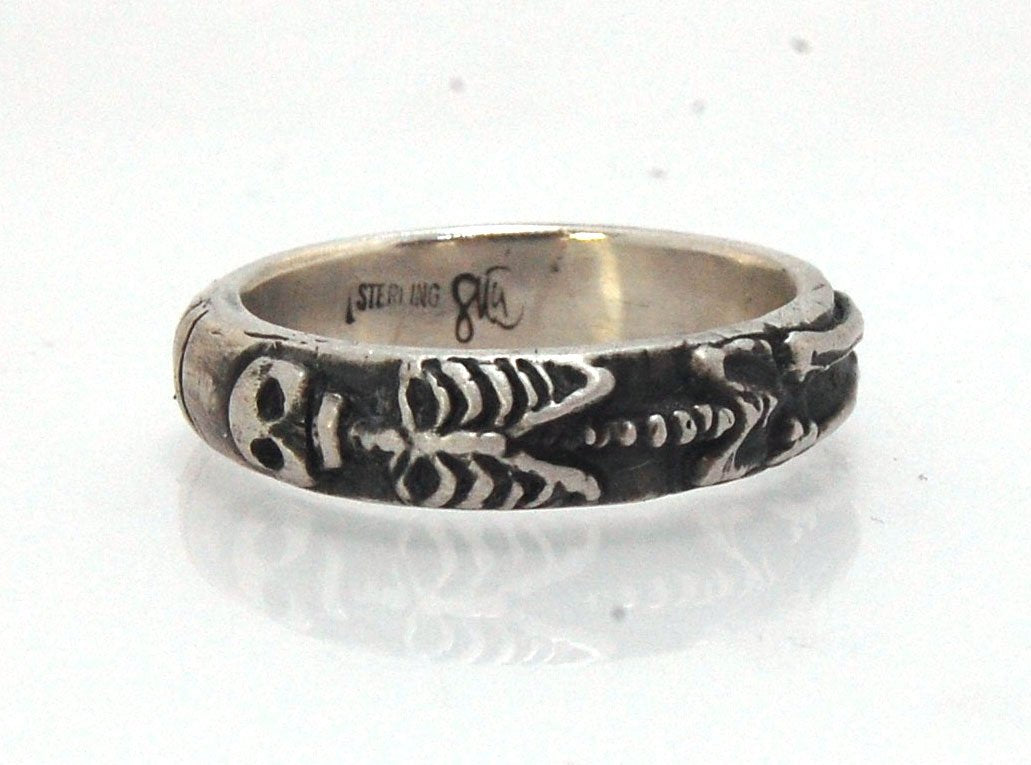 Oxidized Memento Mori Skeleton Ring - Wide 5.5m - Sterling SIlver This is the widest of my Memento Mori rings at 5.5mm wide. The skeleton spans the majority of the band, so I think the smallest I can make this ring without cutting off the design is a size