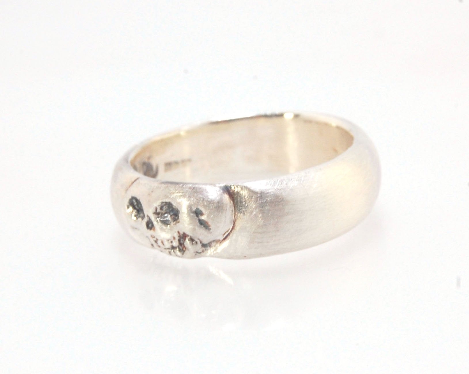 Memento Mori Skull Ring - Wide This is the widest of my Memento Mori skull rings at 7mm. Cast in sterling silver and given a brushed finish after oxidizing the recesses of the skull. Heavyweight, very comfortable.SterlingI made these Memento Mori rings fo