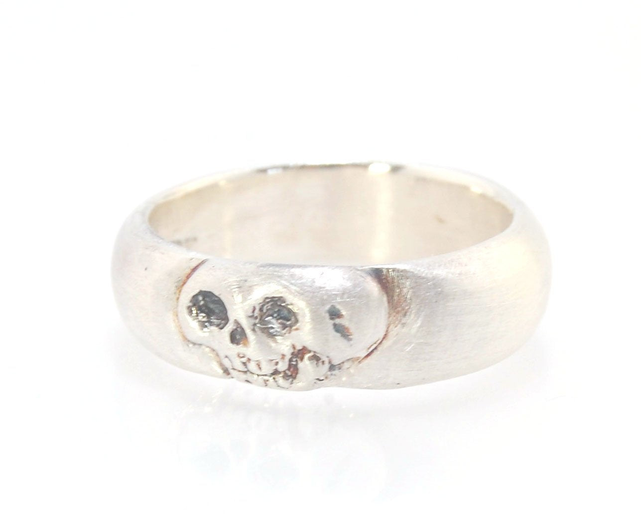 Memento Mori Skull Ring - Wide This is the widest of my Memento Mori skull rings at 7mm. Cast in sterling silver and given a brushed finish after oxidizing the recesses of the skull. Heavyweight, very comfortable.SterlingI made these Memento Mori rings fo