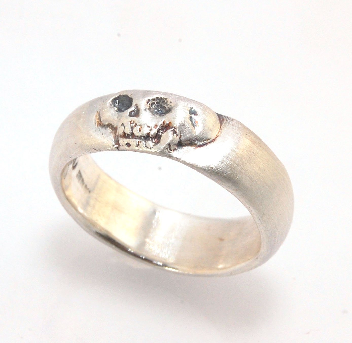 Memento Mori Skull Ring - Wide This is the widest of my Memento Mori skull rings at 7mm. Cast in sterling silver and given a brushed finish after oxidizing the recesses of the skull. Heavyweight, very comfortable.SterlingI made these Memento Mori rings fo