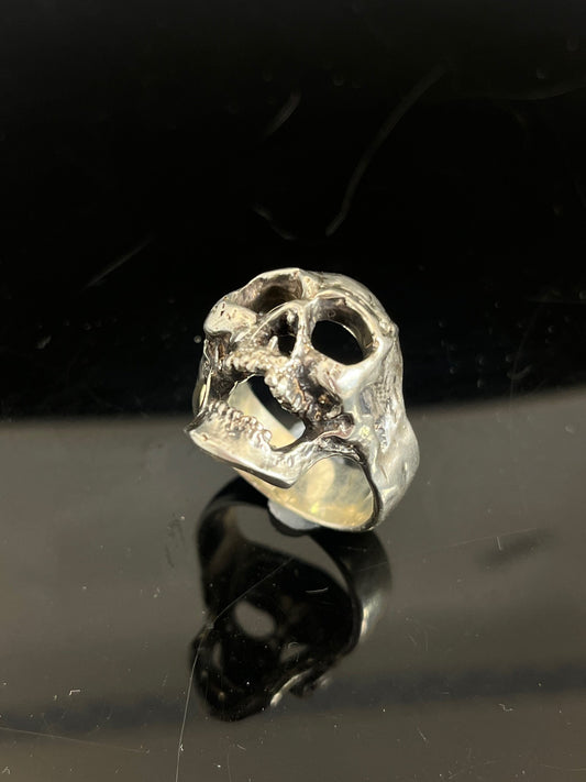 Screaming into the Void Skull Ring This is a lightweight but sizable skull ring that is Made to Order for you in your size. I carved this skull in wax, hollowed out the inside of the skull and cast it using the lost wax casting method. This Screaming into