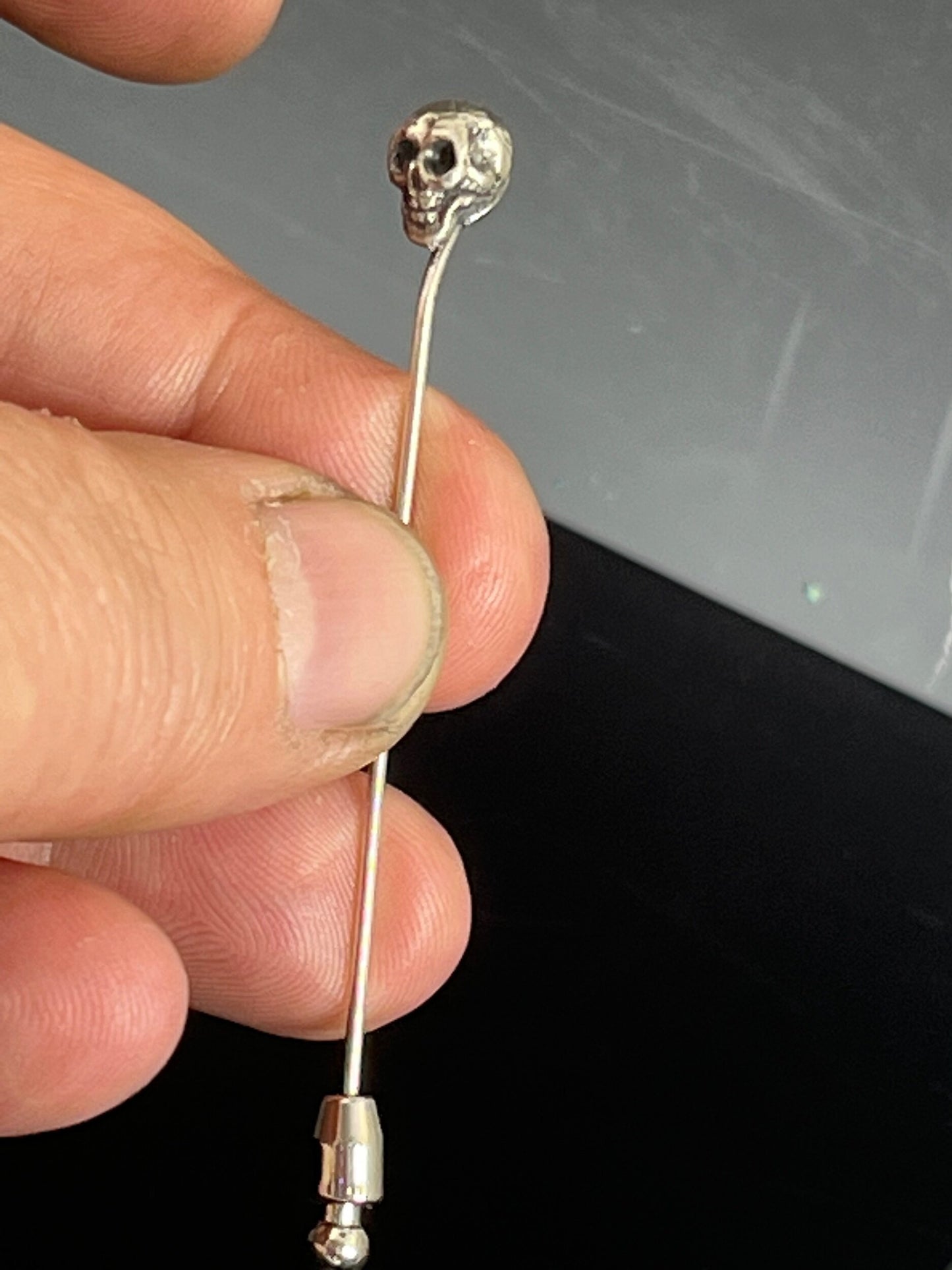 Yorick Skull Stick Pin This Skull Stick Pin is just darling if you like weird stuff. This Skull is wax carved by hand and cast using the ancient process of Lost Wax to cast them in sterling silver. I then made a mold, which I can inject with wax and make