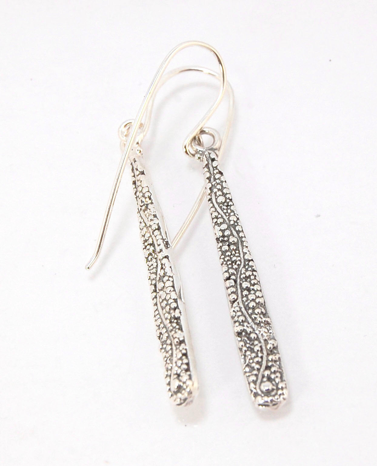 Seaweed Dangles - Long Earrings These seaweed dangle have terrific movement and sparkle. These are cast versions of my original granulation work, which is then molded for repeat waxes and cast using the ancient Lost Wax Process. Granulation is an ancient