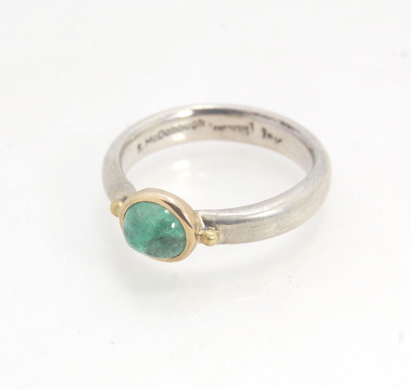 Emerald Bi Metal Freckle Ring - 14k and Sterling Silver - Size 8 This is a unique emerald cabochon with a darker freckle included in the lighter-colored emerald! This emerald cabochon is bezel-set in 14k gold with large gold granules on the Sterling Silve