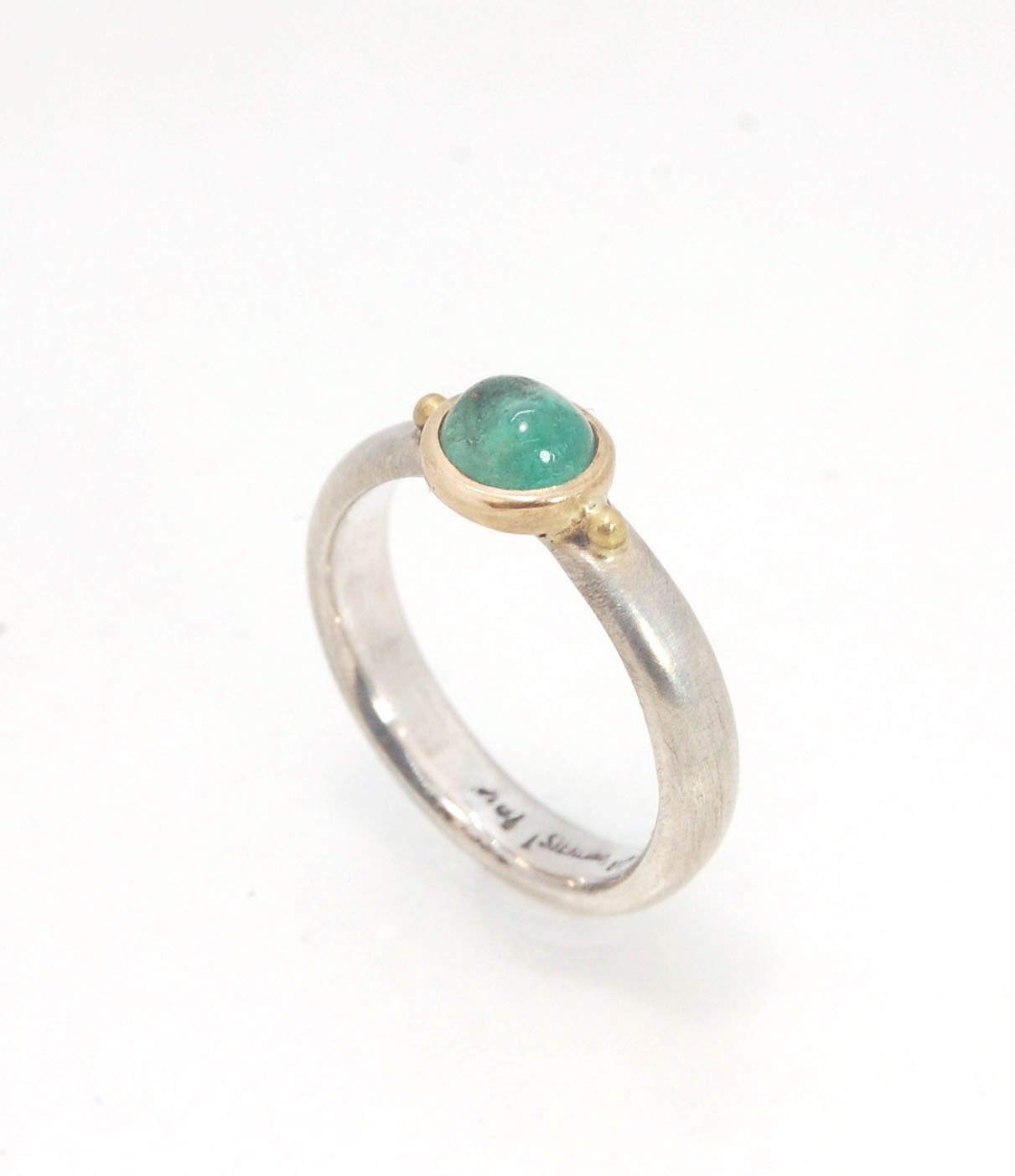 Emerald Bi Metal Freckle Ring - 14k and Sterling Silver - Size 8 This is a unique emerald cabochon with a darker freckle included in the lighter-colored emerald! This emerald cabochon is bezel-set in 14k gold with large gold granules on the Sterling Silve