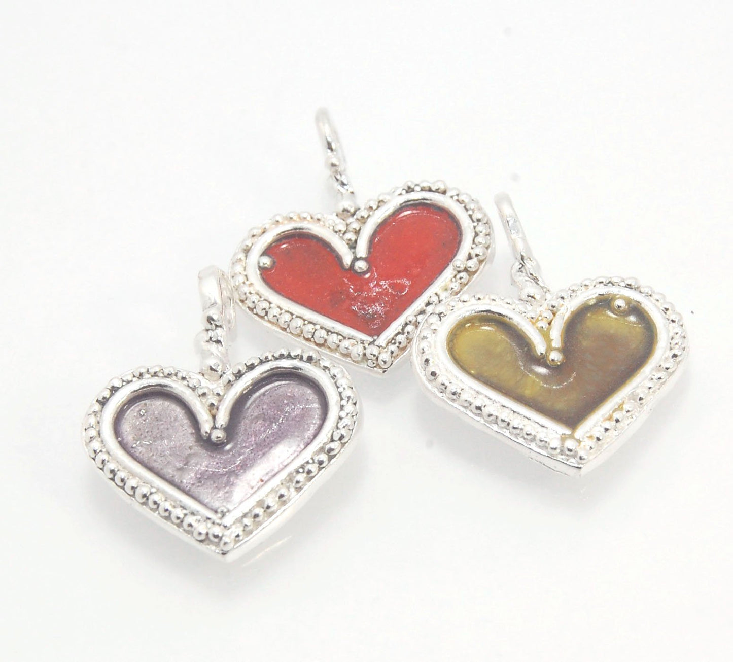 Enamel Heart Charm in Fine SIlver It’s a HEART of fine silver granulation that I made a mold of, then cast, then enameled! In your choice of colors: Red, Purple, Green, Black, Azalea, HollyhockGranulation is an ancient fusing process utilized for thousand