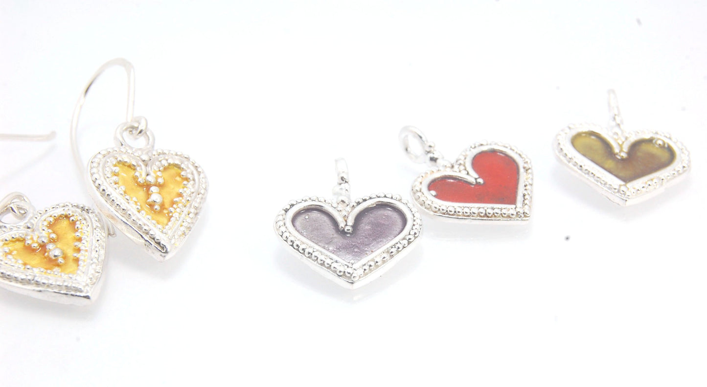 Enamel Heart Charm in Fine SIlver It’s a HEART of fine silver granulation that I made a mold of, then cast, then enameled! In your choice of colors: Red, Purple, Green, Black, Azalea, HollyhockGranulation is an ancient fusing process utilized for thousand