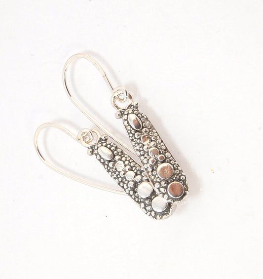 'Gator Pattern Silver Earrings with French Hooks These great 'Gator pattern earrings have terrific movement and shine! These are cast versions of the original granulation work, which is then molded for repeat waxes and then cast in my studio. These squigg