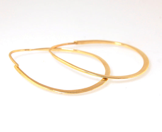 Long Hammered 14k gold Hoops These very lightweight hoops are shaped and hammered 14k gold. 35mm x 25mm