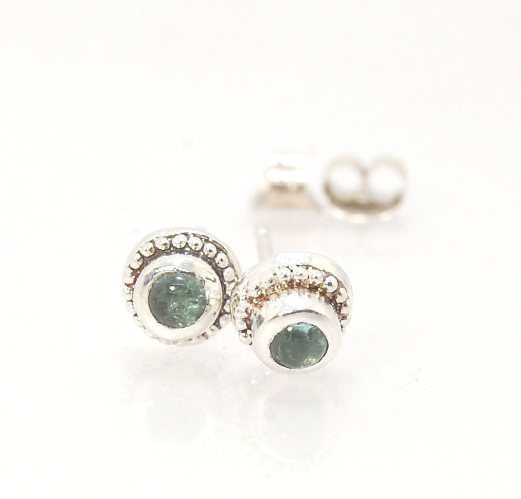 BlueGreen Tourmaline Tiny Post Earrings in Sterling Silver These are tiny bezel settings I created using the ancient process of granulation. Then I made a mold of it and injected the mold with wax and used that wax to create a Sterling Silver version of t