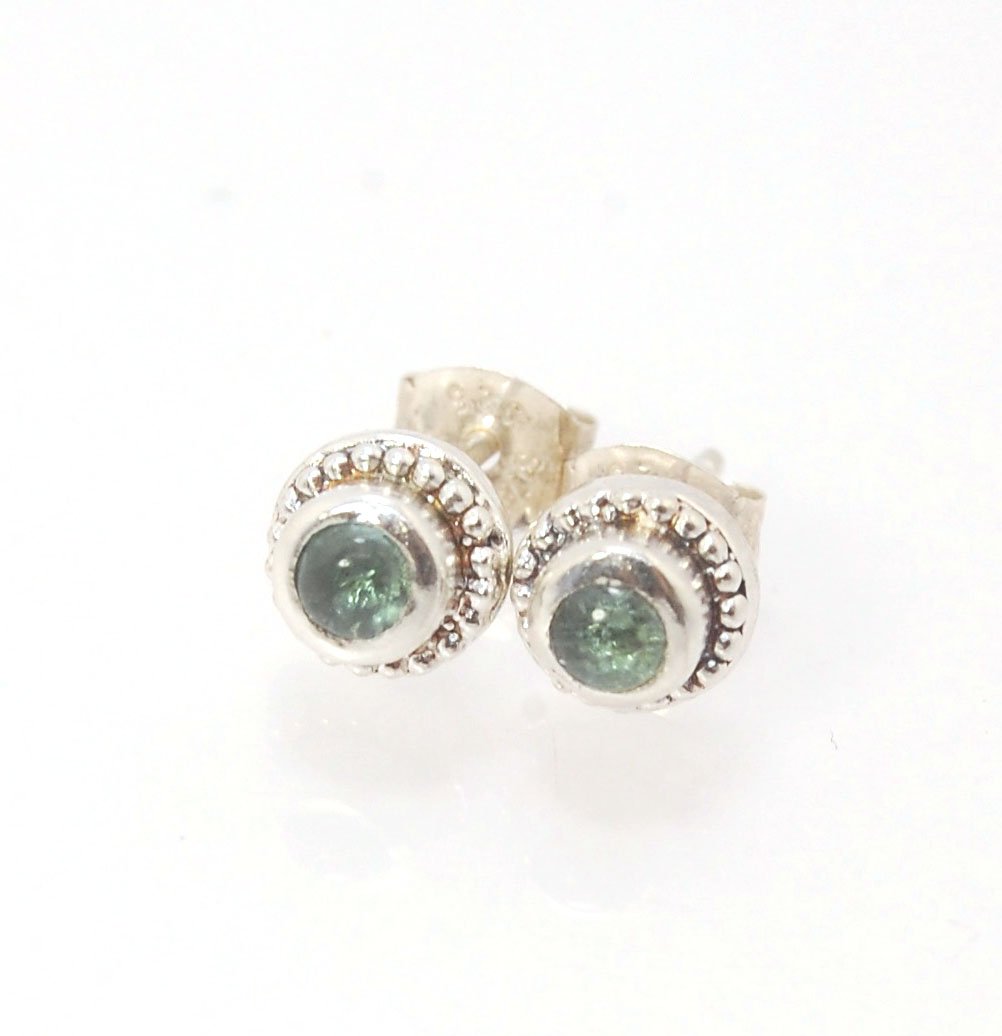 BlueGreen Tourmaline Tiny Post Earrings in Sterling Silver These are tiny bezel settings I created using the ancient process of granulation. Then I made a mold of it and injected the mold with wax and used that wax to create a Sterling Silver version of t