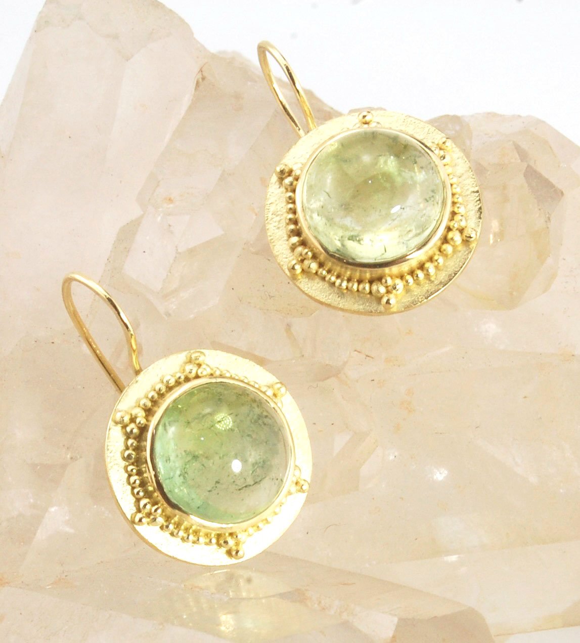 Green Bi-color Tourmaline 18k Gold Granulation Earrings These Green Bi-color Tourmaline 18k Gold Granulation Earrings are Classically-inspired 18k granulation. With 2 luminous and clear bi-color tourmaline cabochons bezel-set in 18k an accented ring of 18