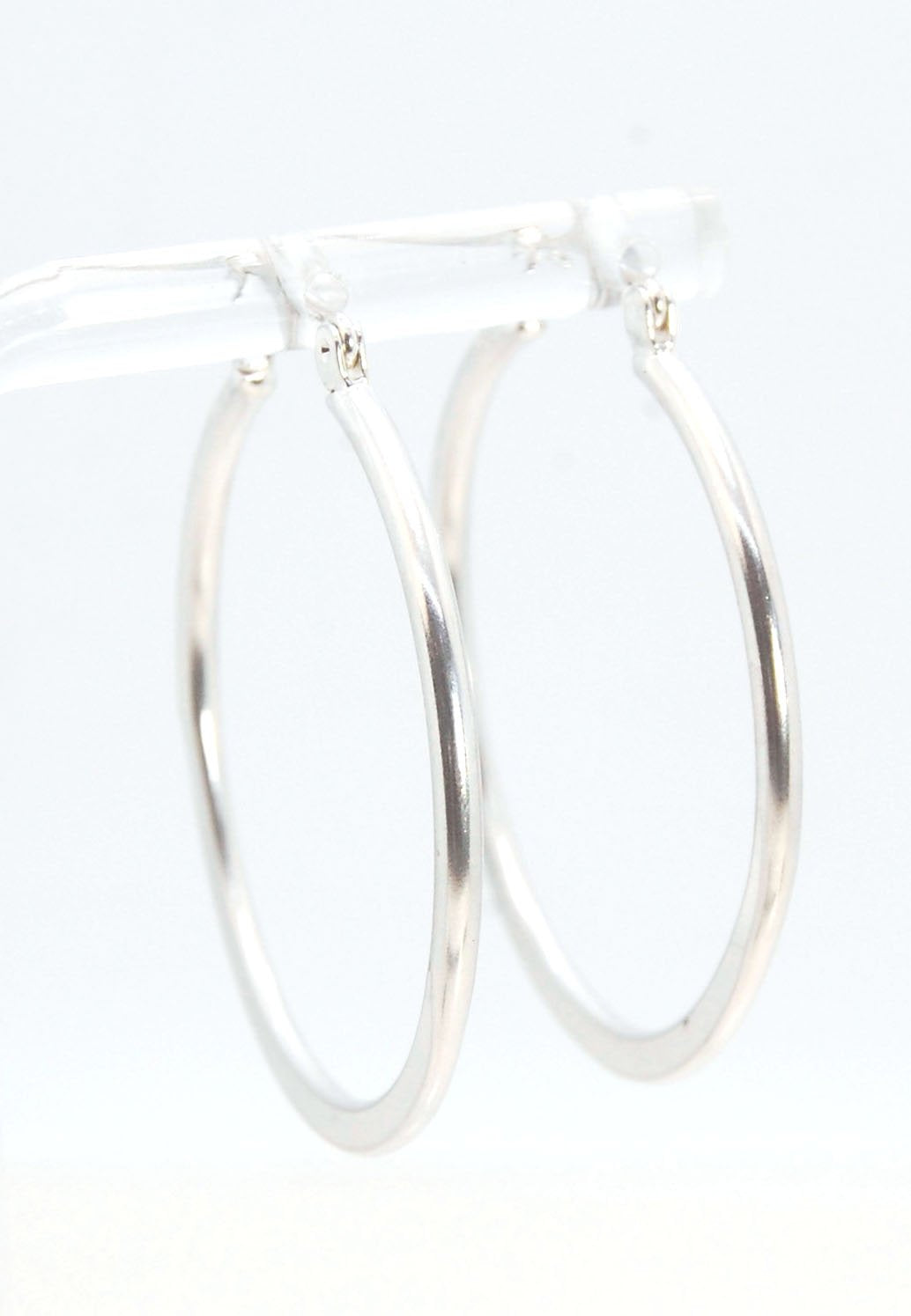 Hammer Forged Hoops - Large - Sterling These are Classic hammer-forged hoop earrings. These elegant hoops have a secure hoop catch with a satisfying snap. They are secure, lightweight and comfortable enough to wear everyday! You may even sleep in them!The