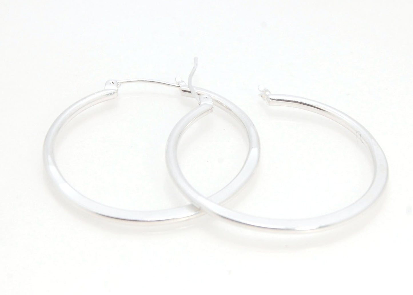 Hammer Forged Hoops - Large - Sterling These are Classic hammer-forged hoop earrings. These elegant hoops have a secure hoop catch with a satisfying snap. They are secure, lightweight and comfortable enough to wear everyday! You may even sleep in them!The