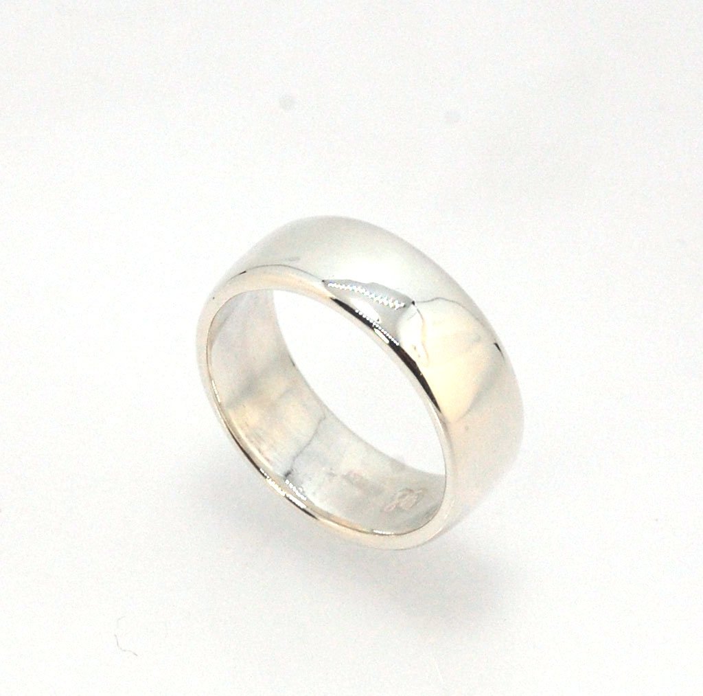 Real Wide Flat Half Round Band Ring in Sterling Silver This is a Real Wide Flat Half Round Band Ring cast from a wax carving. 8mm wide and 2.5mm thick, this ring was turned on a lathe in wax and cast using the lost wax process. These are so much fun to ma