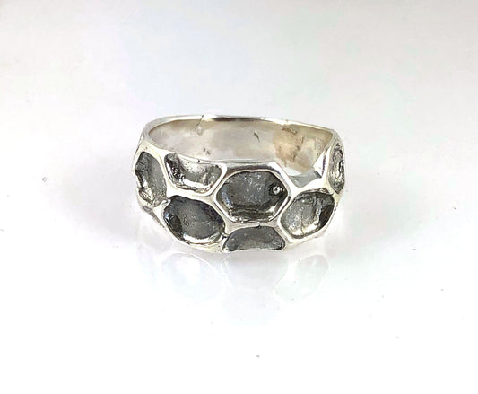 Honeycomb Ring Inspired by Bees and all they do for us! This Honeycomb Band Ring is comfortable and weighty. Carved in wax and cast using the ancient lost-wax process in Sterling Silver. I then add a patina to the recesses and polish the high points.MADE