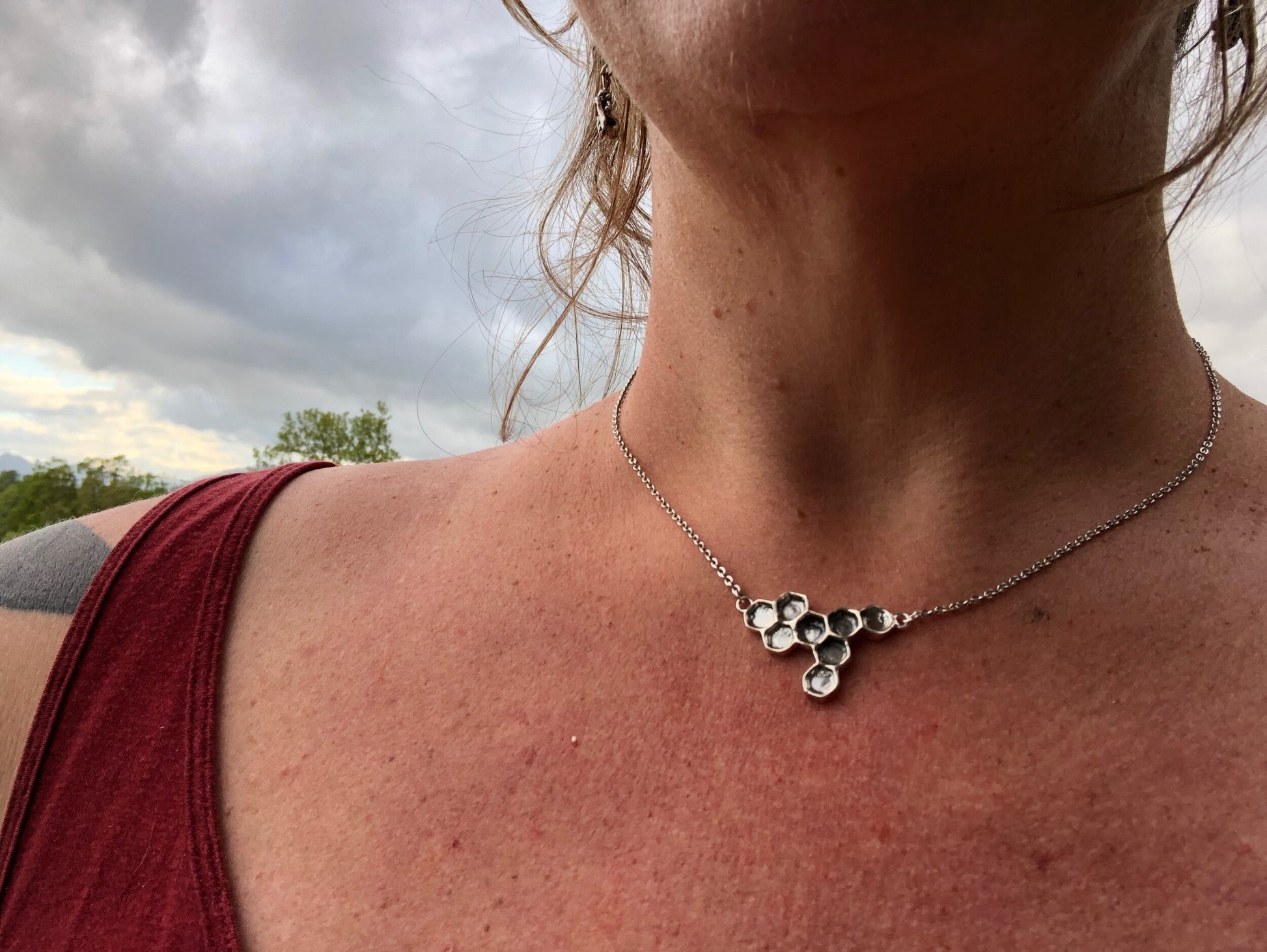 Honeycomb Necklace Honeycomb NecklaceThis Honeycomb Necklace has a great weight and shimmer. It was carved in wax and cast using the ancient lost-wax process in Sterling Silver. Inspired by our pollinator friends, the Bees, and the beauty they produce eve