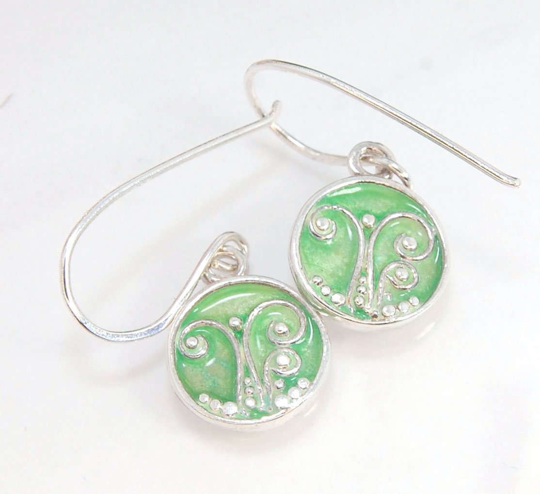 Enameled Sterling Fern Earrings -Circle -Medium These are my medium fern circles and they can be enameled in 8 colors for you!Prussian Blue, Icy Blue, Turquoise, Oil Gray, Forest Green, Jade Green, Sage Green or Periwinkle BlueGreen.These enameled 11mm ov