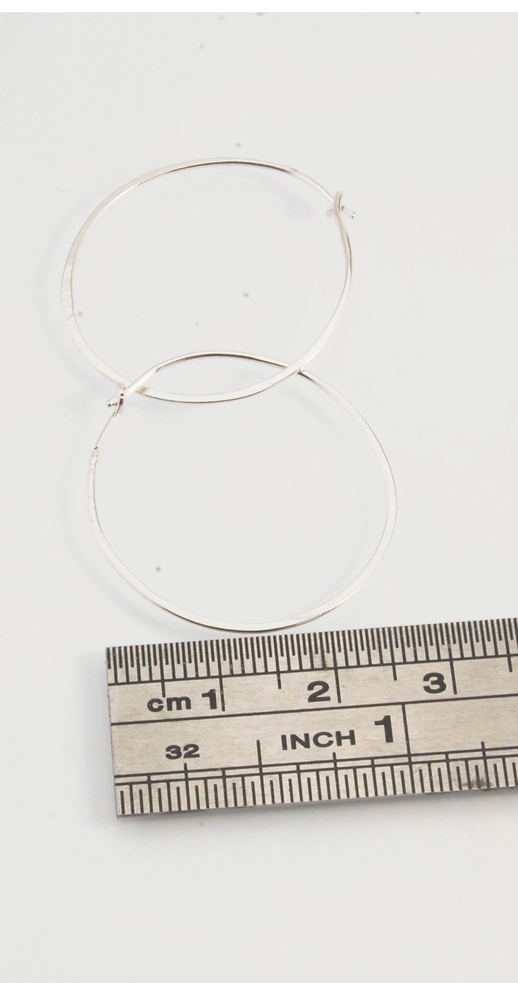 Hammered Hoops - Sterling - Small, Medium and Large Looking for an affordable handmade gift? Or some super lightweight Sterling Silver Hoops you can live in? These classic wire hammered hoops you can sleep and live in are forged from 20 gage Sterling wire