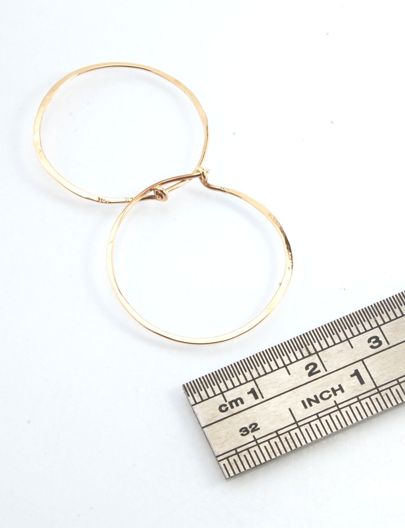 Hammered 14k Hoops - Small, Medium and Large These are exactly the same as my hammered sterling hoops, but they are made of solid 14k gold! They are super lightweight, classic wire hammered hoops you can sleep and live in. These delicate hoops are forged