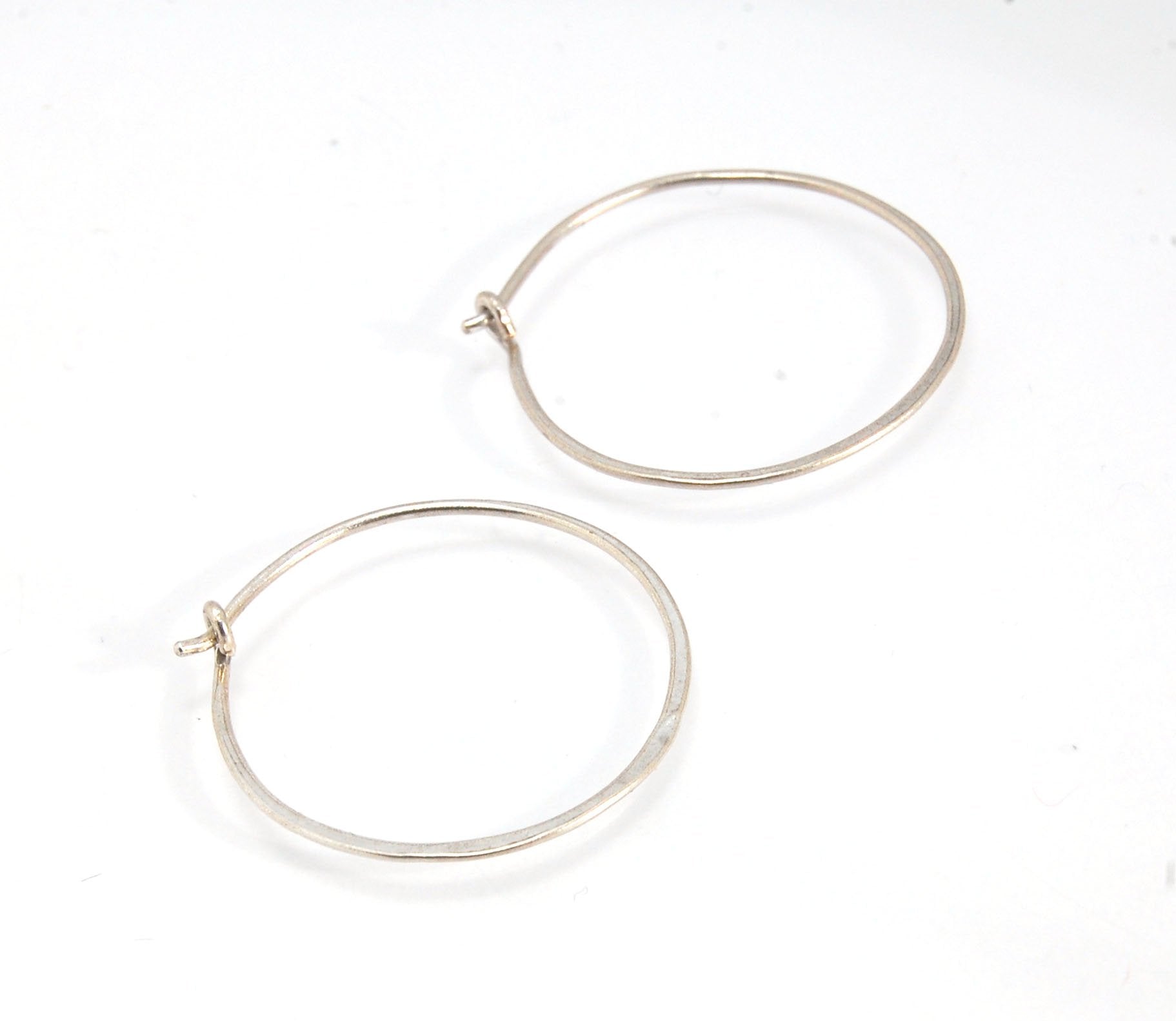 Hammered Hoops - Sterling - Small, Medium and Large Looking for an affordable handmade gift? Or some super lightweight Sterling Silver Hoops you can live in? These classic wire hammered hoops you can sleep and live in are forged from 20 gage Sterling wire