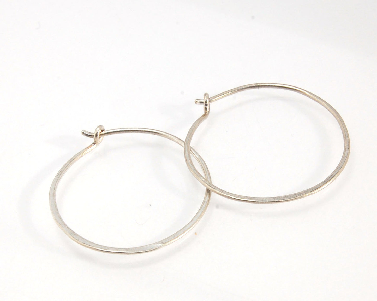 Hammered Hoops - Sterling - Small, Medium and Large Looking for an affordable handmade gift? Or some super lightweight Sterling Silver Hoops you can live in? These classic wire hammered hoops you can sleep and live in are forged from 20 gage Sterling wire