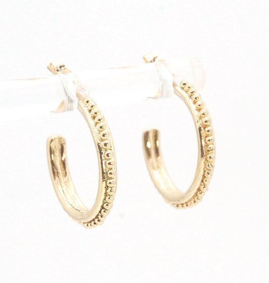 Etruscan hoop posts in 14k Gold - Medium-SQ5258500 These 14k yellow gold hoops are cast in my studio from a granulated master for a limited edition series of hoops. I use fine silver for the original granulation, then make a mold, pull a wax copy from the