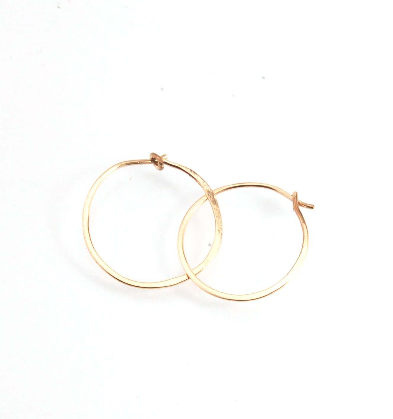 Hammered 14k Hoops - Small, Medium and Large These are exactly the same as my hammered sterling hoops, but they are made of solid 14k gold! They are super lightweight, classic wire hammered hoops you can sleep and live in. These delicate hoops are forged