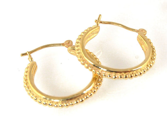 Etruscan hoops in 14k Gold - Medium These 14k yellow gold hoops are cast in my studio from a granulated master for a limited edition series of hoops. I use fine silver for the original granulation, then make a mold, pull a wax copy from the mold, then cas