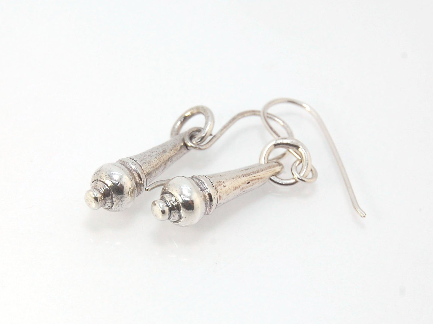 MET Drop Dangles in Sterling A play on an ancient Roman pair of Earrings I saw at the MET, these cast sterling dangle earrings have a great weight and terrific movement! I carved tthe original dangle from wax and then cast it using the Lost Wax process. T