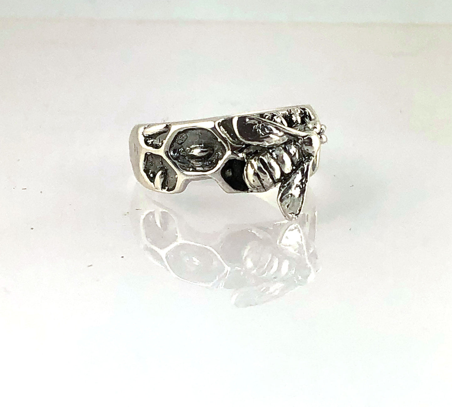 Milk Brood Bee Ring Carved in wax and cast in Sterling Silver, this Milk Brood Bee Ring has carved honeycomb cells with the Future of the Hive just starting! Baby Bee larvae look a lot like tiny grubs. Beekeepers call larvae uncapped brood or “milk brood”