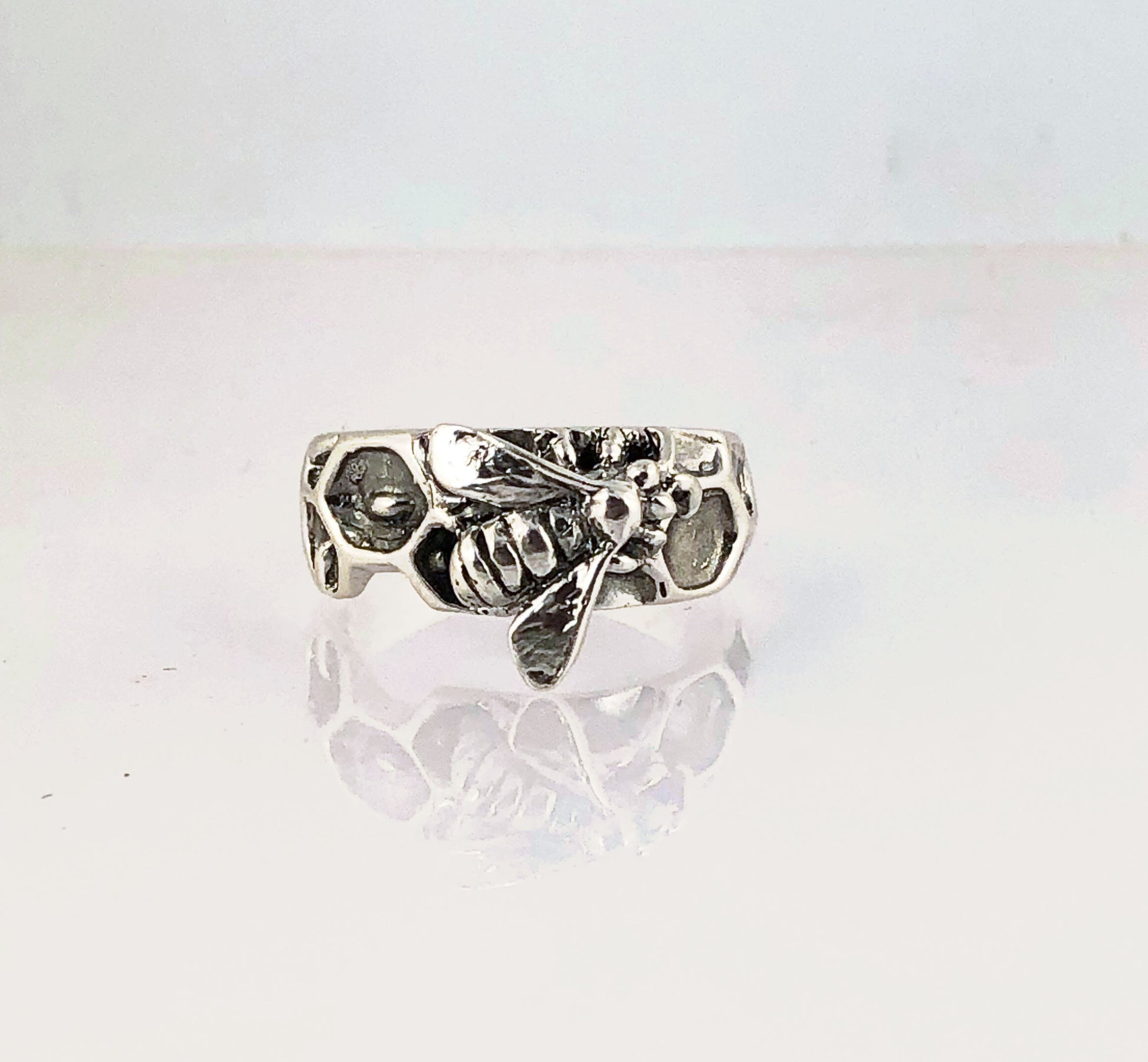 Milk Brood Bee Ring Carved in wax and cast in Sterling Silver, this Milk Brood Bee Ring has carved honeycomb cells with the Future of the Hive just starting! Baby Bee larvae look a lot like tiny grubs. Beekeepers call larvae uncapped brood or “milk brood”