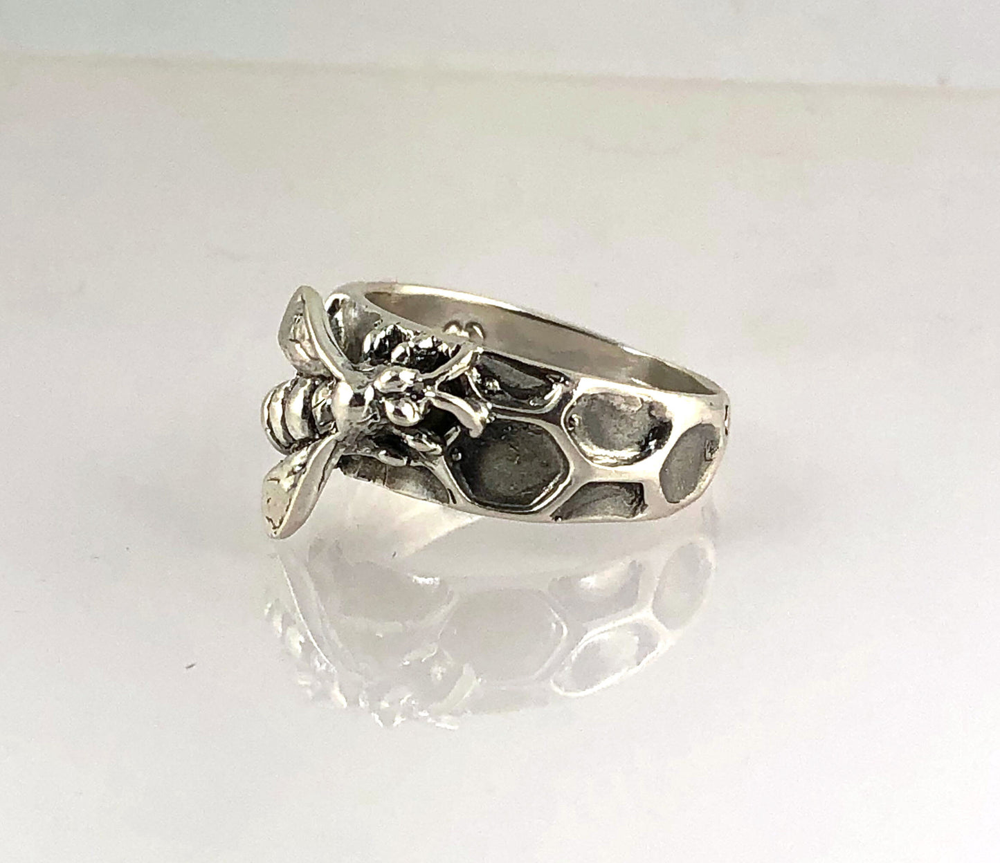 Milk Brood Bee Ring Carved in wax and cast in Sterling Silver, this Milk Brood Bee Ring has carved honeycomb cells with the Future of the Hive just starting! Baby Bee larvae look a lot like tiny grubs. Beekeepers call larvae uncapped brood or “milk brood”