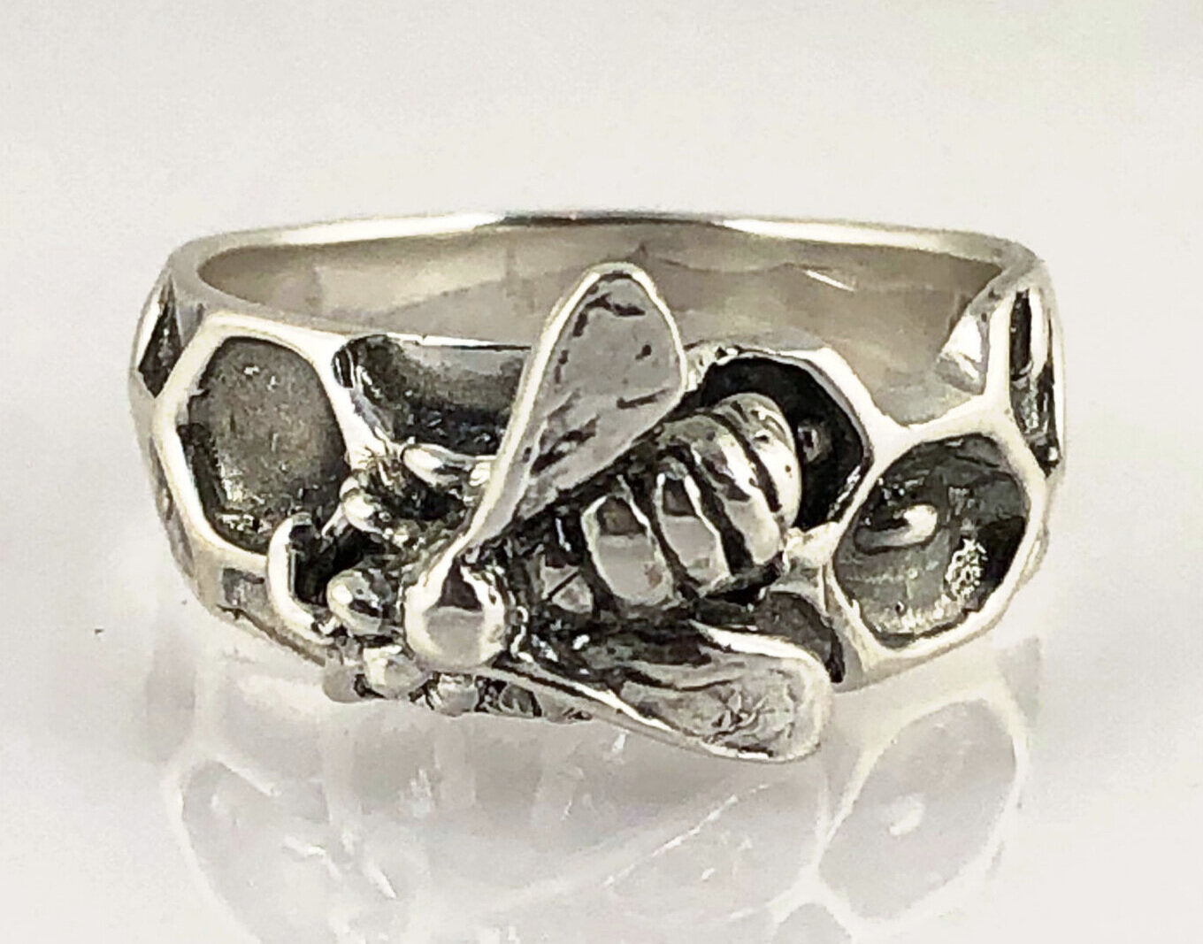 Milk Brood Bee Ring Carved in wax and cast in Sterling Silver, this Milk Brood Bee Ring has carved honeycomb cells with the Future of the Hive just starting! Baby Bee larvae look a lot like tiny grubs. Beekeepers call larvae uncapped brood or “milk brood”