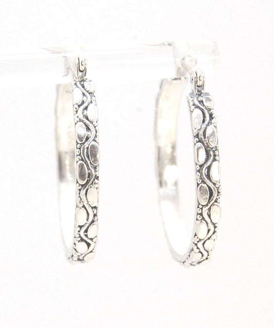 Ovals Pattern Hoops - Sterling in 3 sizes These Hoops are made from an Ovals pattern with heavy granules and ingot slices and have a hoop catch with a satisfying snap.These Ovals Hoops come in 3 sizes Large - 3mm wide and 1.25” in diameterMedium - 3mm wid