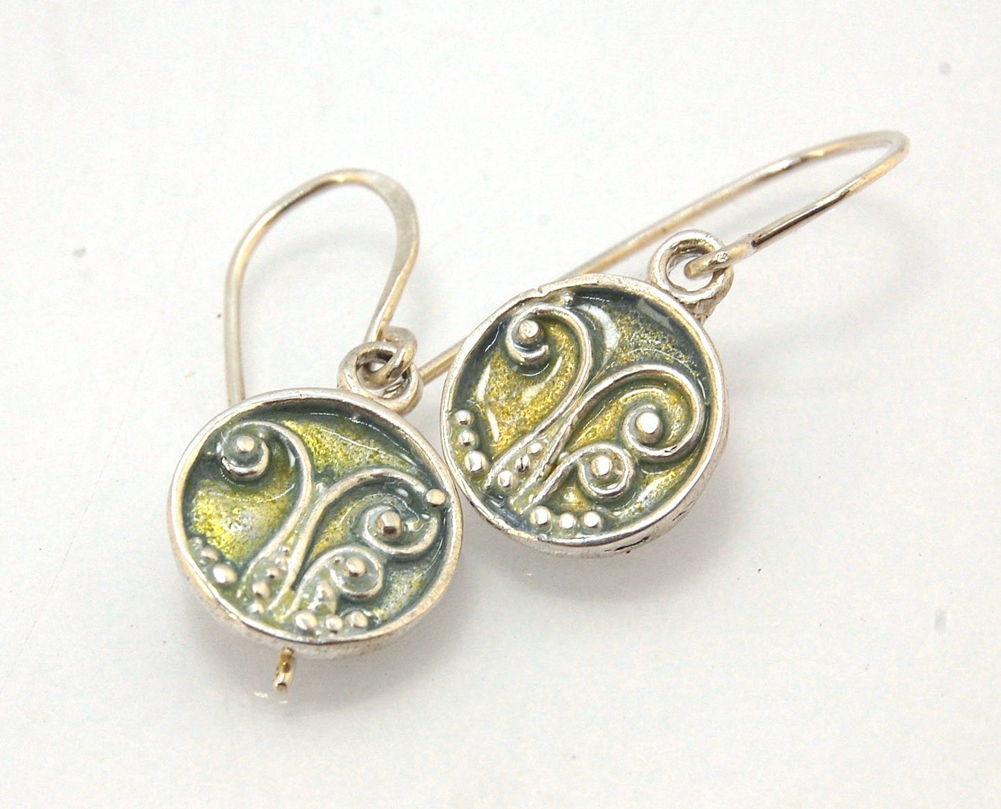 Enameled Sterling Fern Earrings -Circle -Medium These are my medium fern circles and they can be enameled in 8 colors for you!Prussian Blue, Icy Blue, Turquoise, Oil Gray, Forest Green, Jade Green, Sage Green or Periwinkle BlueGreen.These enameled 11mm ov