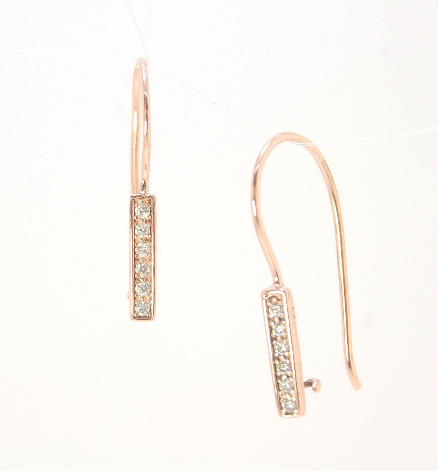 Short Tiny Diamond Earrings with french Hook and clasp - 14k Rose Gold These great little sparklers are subtle enough for every day as long as you don’t mind everyone noticing! They have 6 x 1.3mm diamonds in a single pave row. Earrings have french hook a