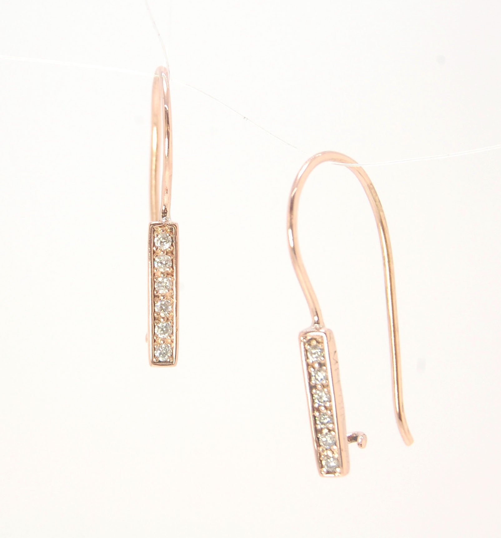 Short Tiny Diamond Earrings with french Hook and clasp - 14k Rose Gold These great little sparklers are subtle enough for every day as long as you don’t mind everyone noticing! They have 6 x 1.3mm diamonds in a single pave row. Earrings have french hook a