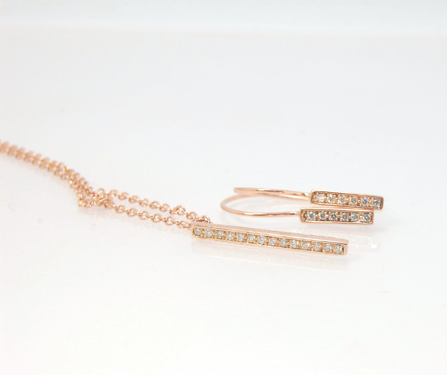 Short Tiny Diamond Earrings with french Hook and clasp - 14k Rose Gold These great little sparklers are subtle enough for every day as long as you don’t mind everyone noticing! They have 6 x 1.3mm diamonds in a single pave row. Earrings have french hook a