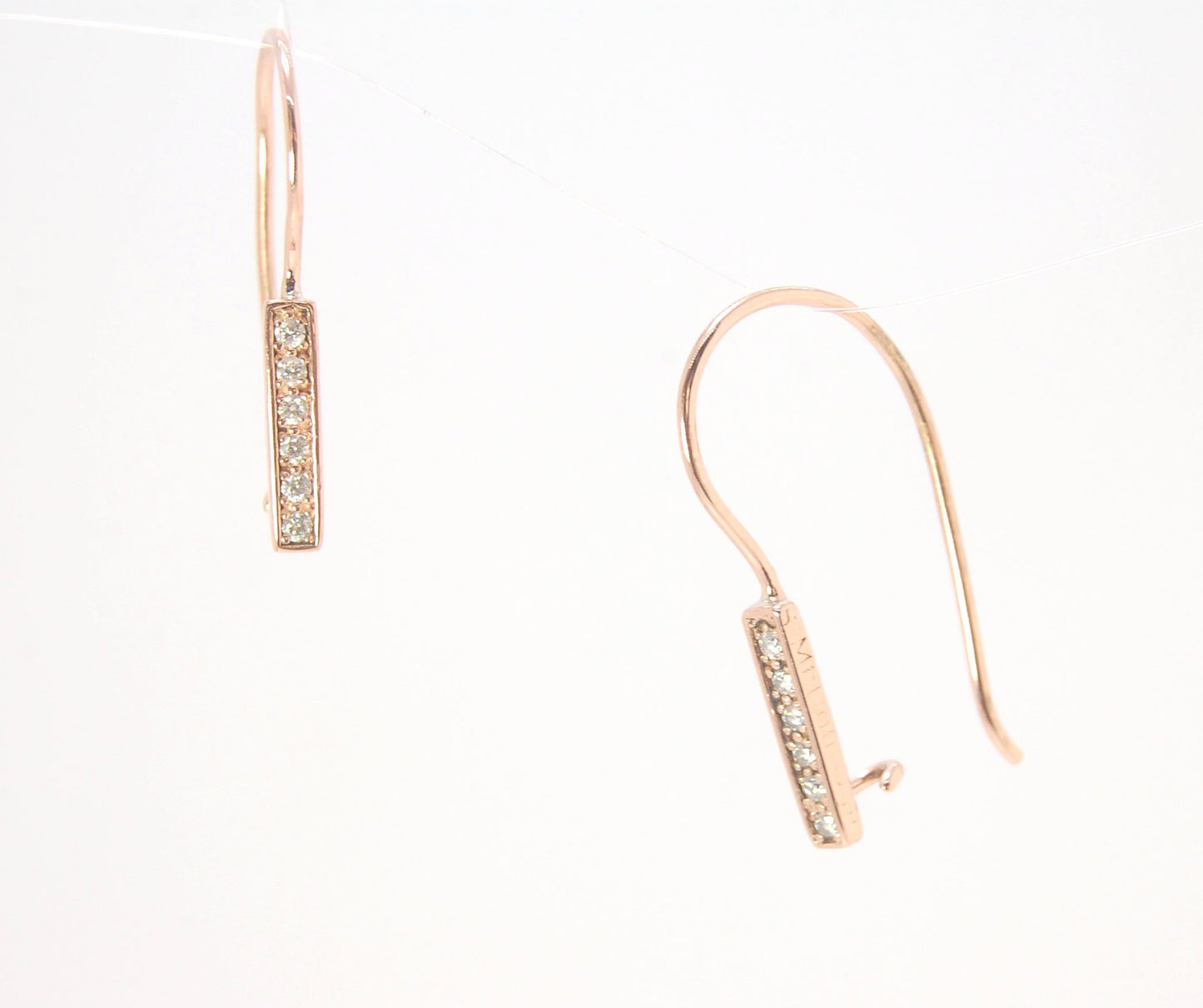 Short Tiny Diamond Earrings with french Hook and clasp - 14k Rose Gold These great little sparklers are subtle enough for every day as long as you don’t mind everyone noticing! They have 6 x 1.3mm diamonds in a single pave row. Earrings have french hook a